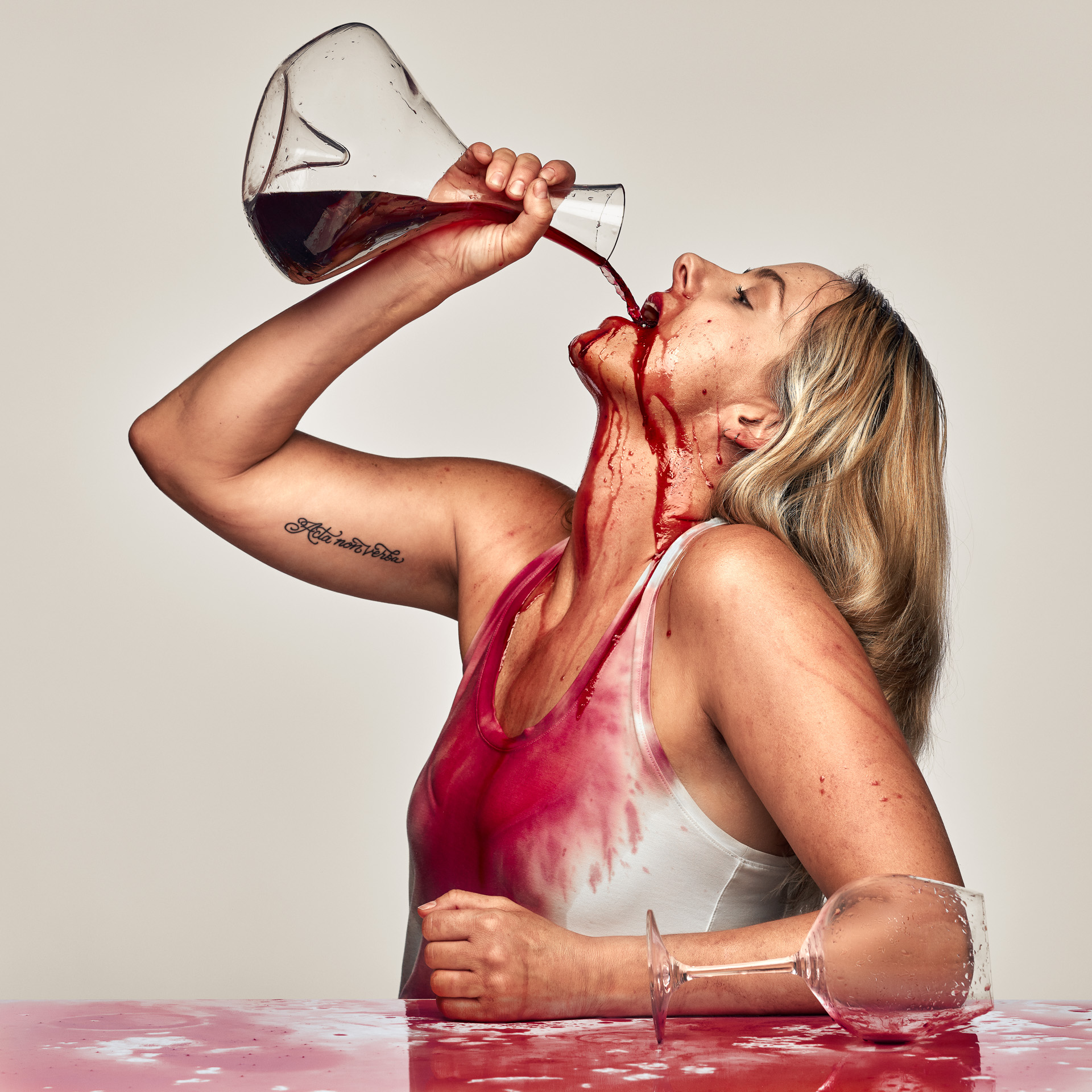 Commercial Portrait of Kelsey Christopherson Drinking red Wine